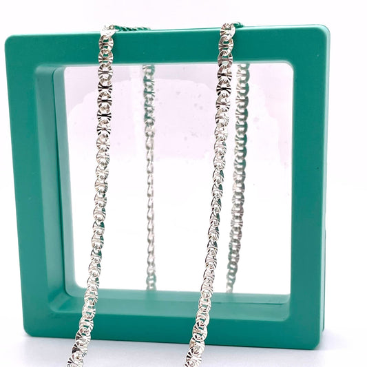 925 Sterling Silver Flat Dapped Mariner chain for permanent jewelry in a green hallow box.