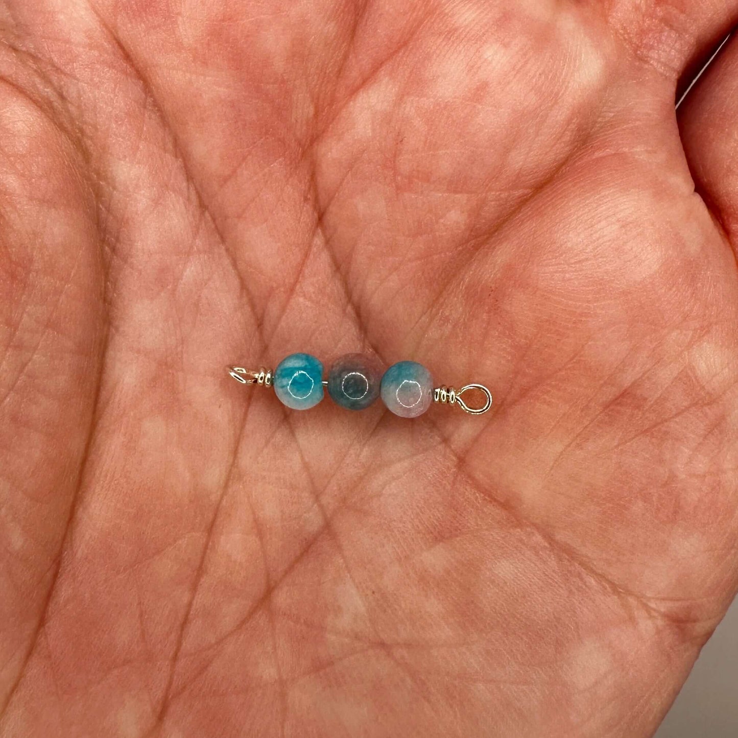 Handmade Blue & Red Jade Connectors on hand