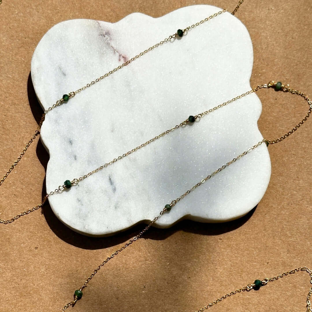 Emerald Gemstone Chain on marble plate